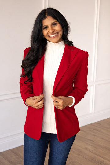 Tailored Caroline velvet blazer in deep burgundy with a classic lapel collar and long sleeves.