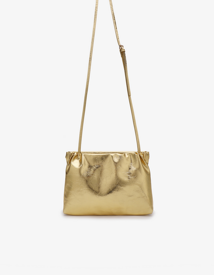 Ophelia clutch in light gold hardware with adjustable crossbody strap