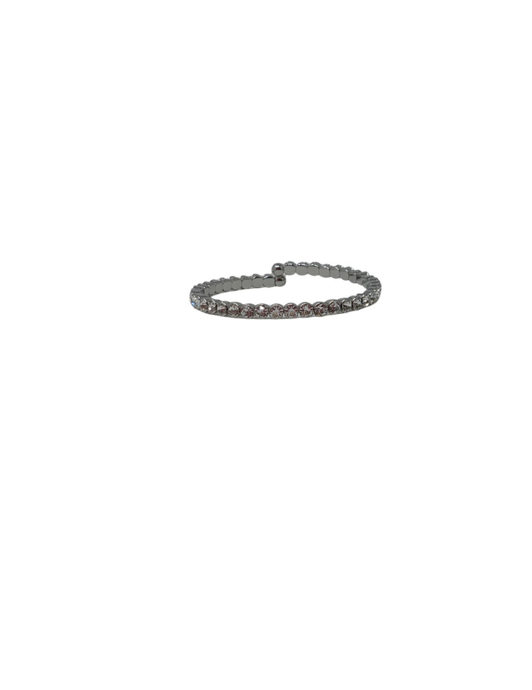 Silver-tone crystal cuff ring featuring a single row of round clear crystals on a flexible band.