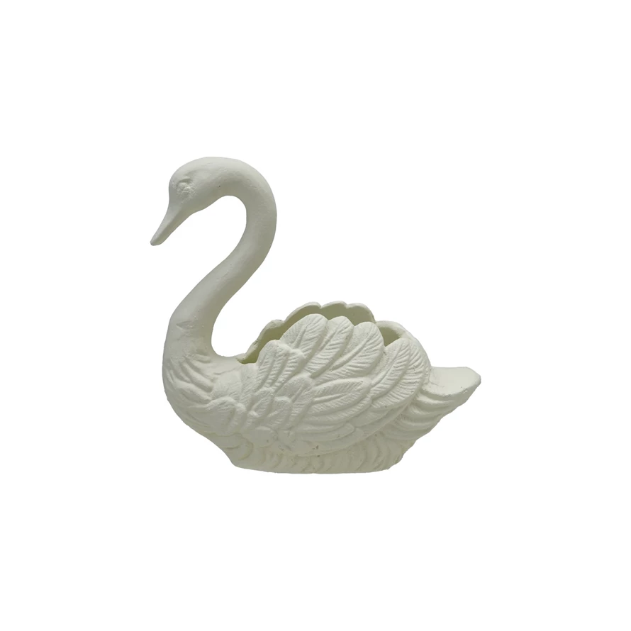 White decorative cast iron swan container with detailed feather textures.