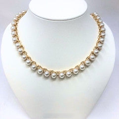 Gold tone faux pearl chain necklace with a delicate link design