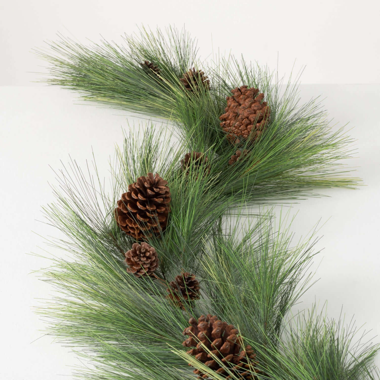 6-foot green polyvinyl chloride pine garland with realistic cones