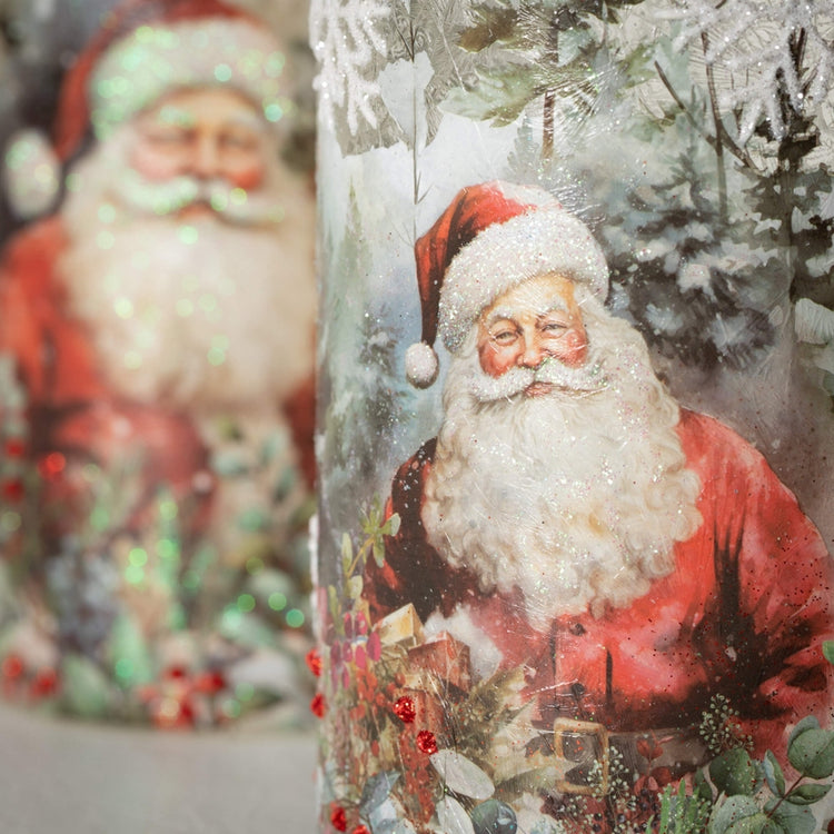 Close-up of a glass Santa Candleholder featuring a vintage-style Santa Claus with glitter accents.