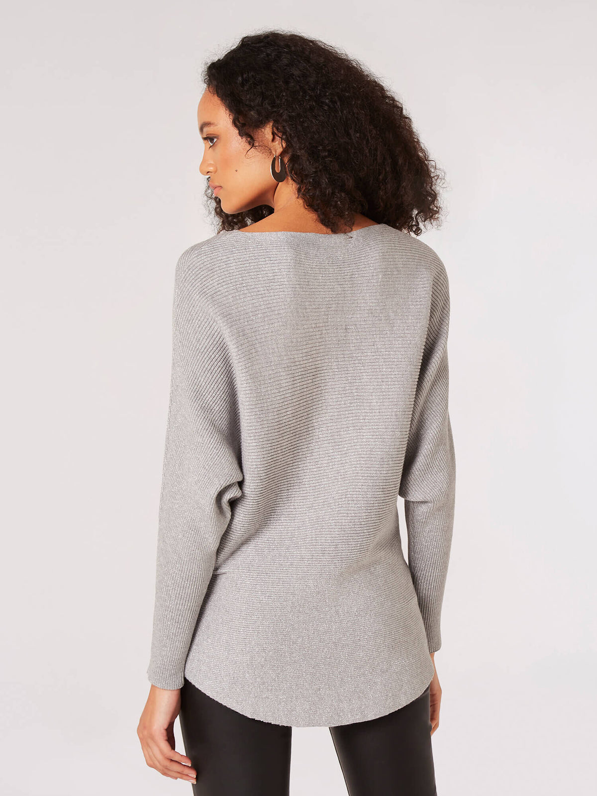Evelyn Lurex ribbed batwing top in black with a relaxed silhouette and long sleeves.