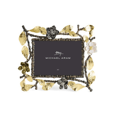 Antique gold vintage frame with oxidized finish holding a white photo.