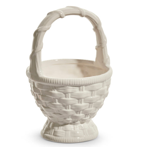 White ceramic basket with a cylindrical shape measuring 7.5 inches tall.