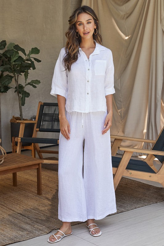 Amalia Linen button-down shirt in natural color with three-quarter sleeves.