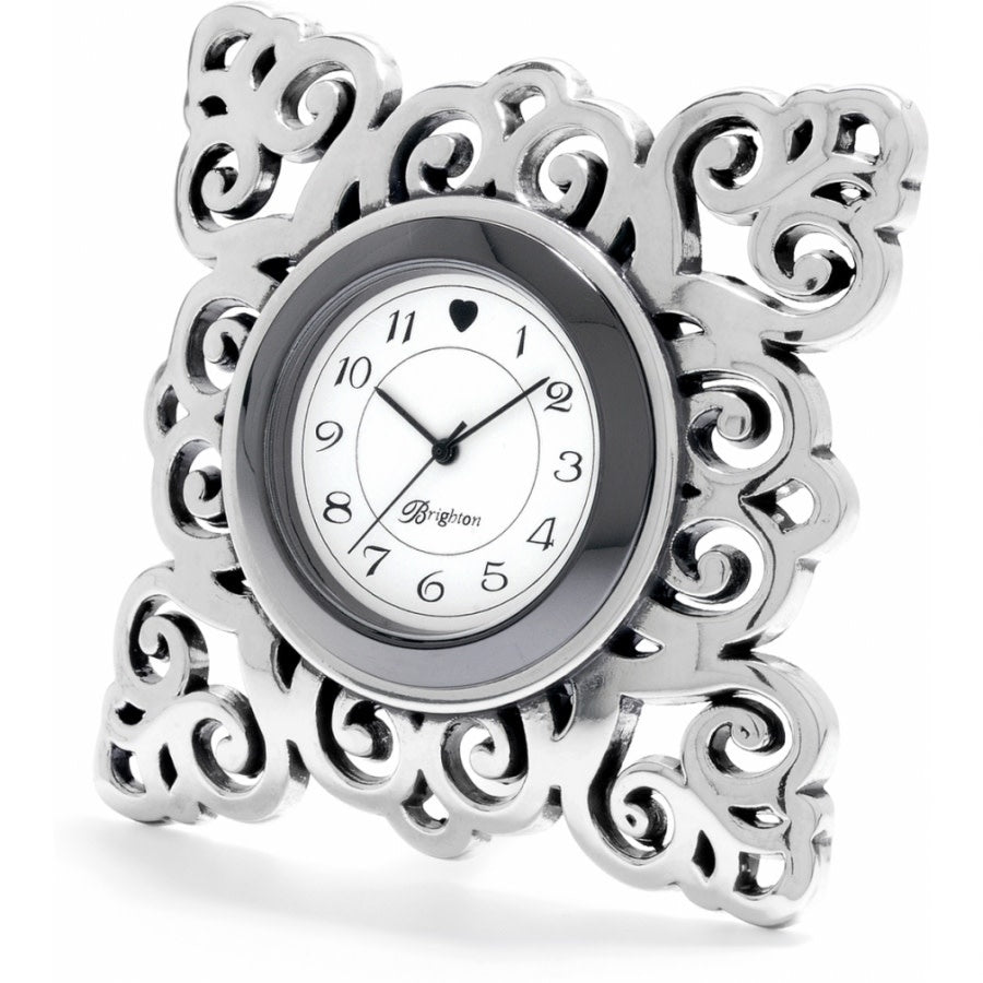 Silver plated Geneva clock with Victorian-inspired cutout snowflake patterns on a swivel arm.