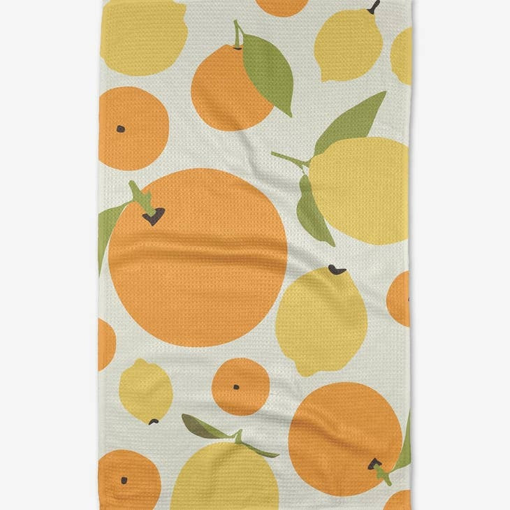 Sunny lemons and oranges geometric print on an everyday tea towel with waffle weave construction.