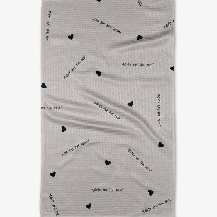 Recycled polyester waffle weave tea towel with a geometric print pattern in neutral tones.
