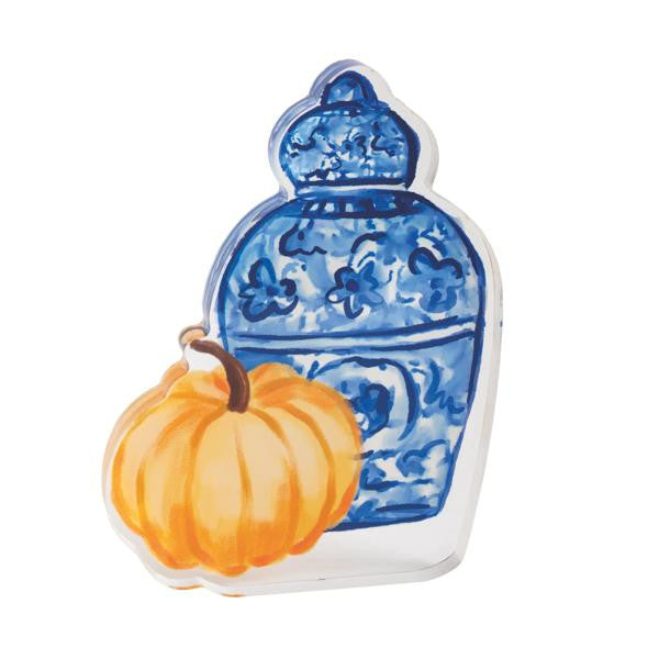 Acrylic sitter featuring a blue and white ginger jar with floral patterns and an orange pumpkin.