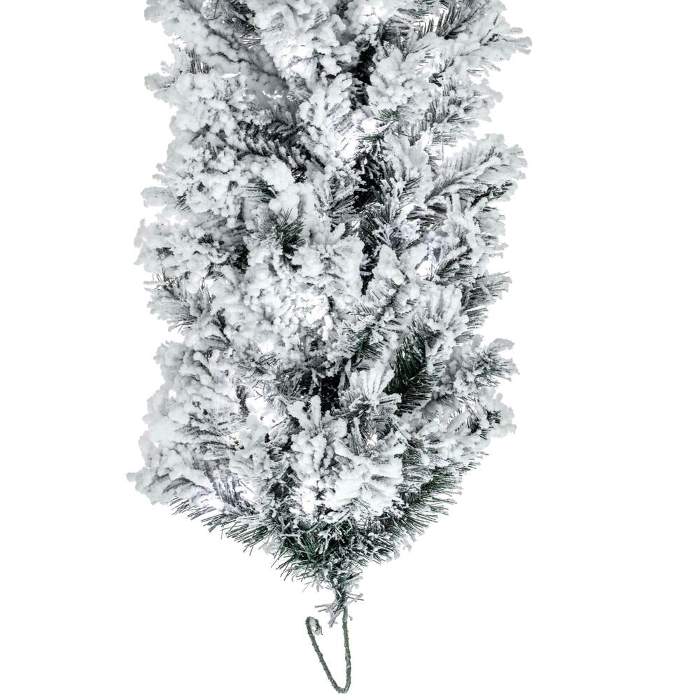 Close-up of a 9-foot flocked Alaskan garland with dense white snow-covered PVC pine needles.