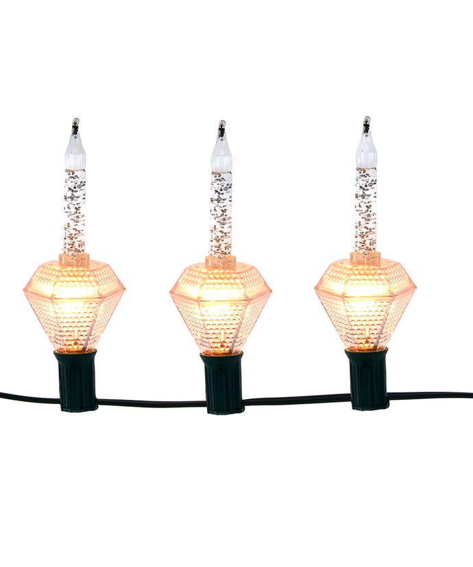 Three silver glitter bubble lights with orange diamond-shaped bases on a green wire.