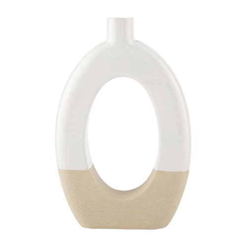 Stoneware cutout vase with a geometric silhouette in neutral stone color.