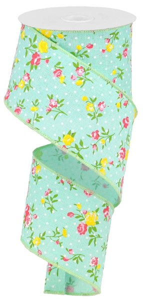 Mint green polyester fabric with vintage floral print featuring white dots on a royal blue background.