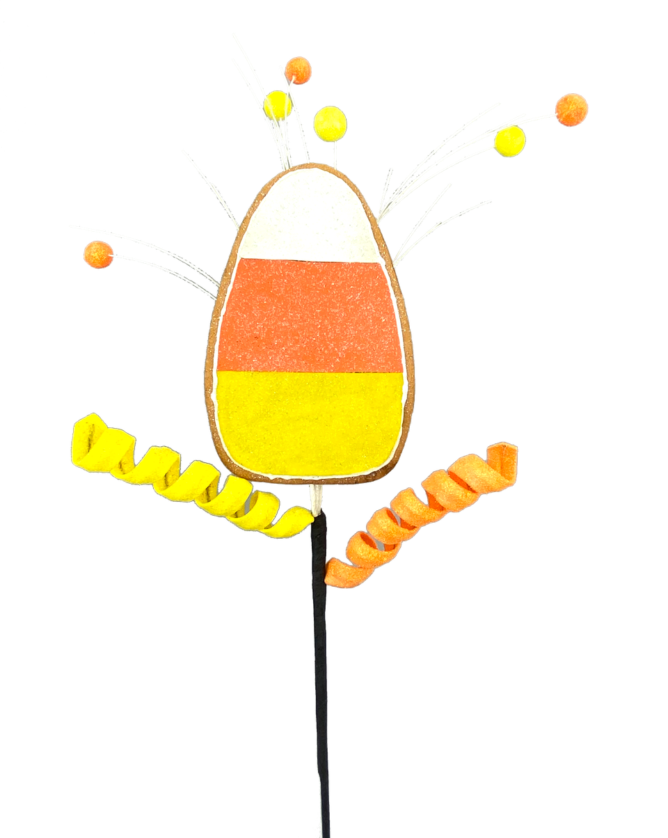 Candy corn cookie spray with a large candy corn cookie, yellow and orange curls, and glitter balls.