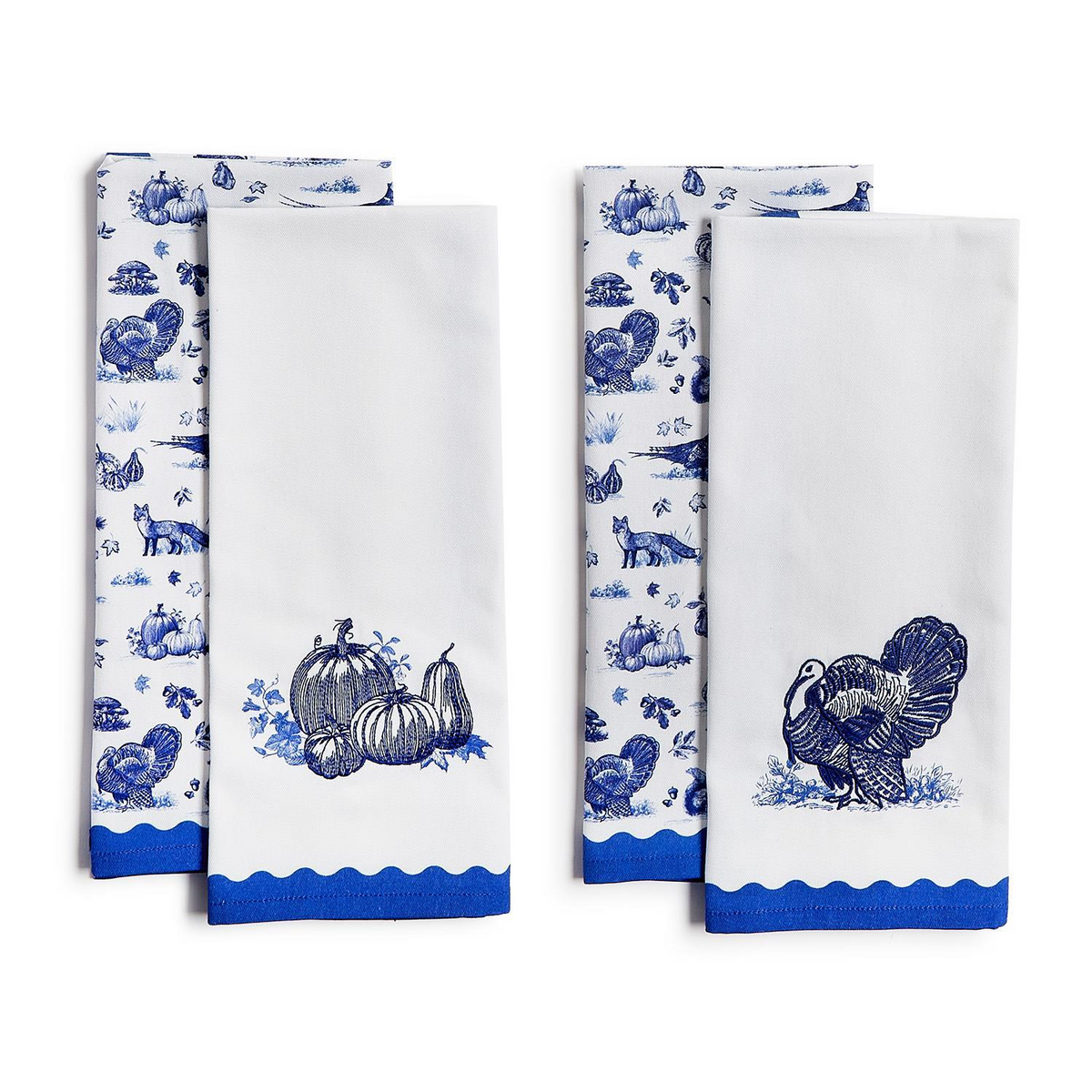 Blue and white toile dish towels with embroidered pumpkins and turkeys and scalloped blue borders.