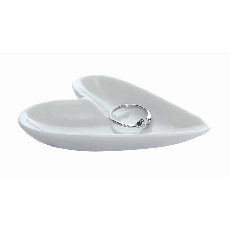 Ceramic heart-shaped ring dish in matte finish with smooth rounded edges.