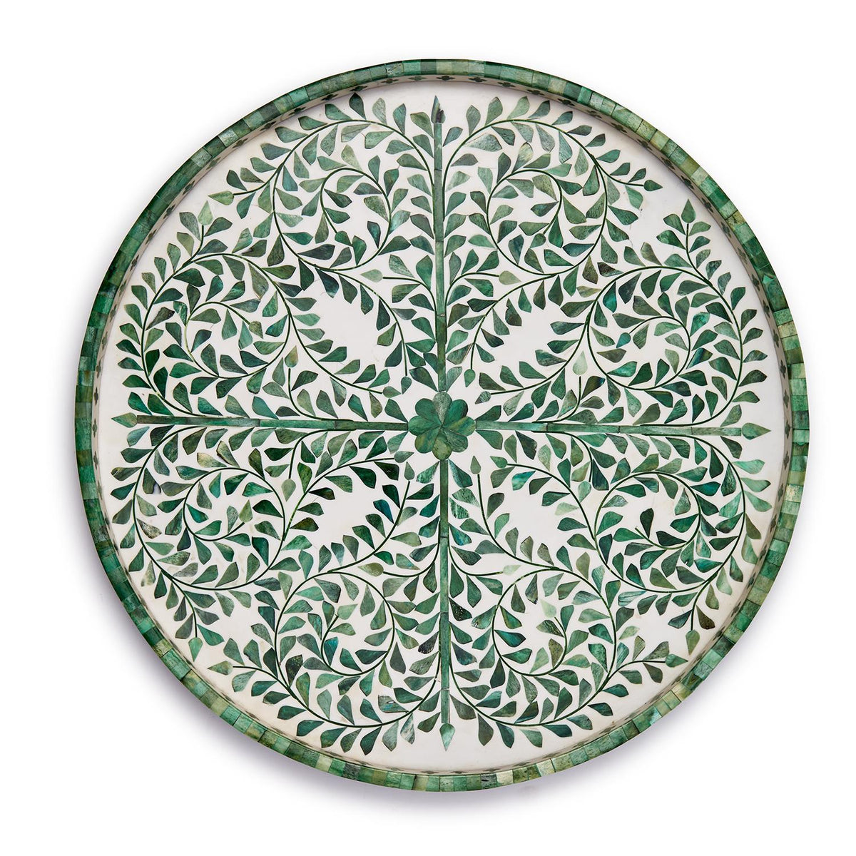 Round green inlaid serving tray with white decorative patterns