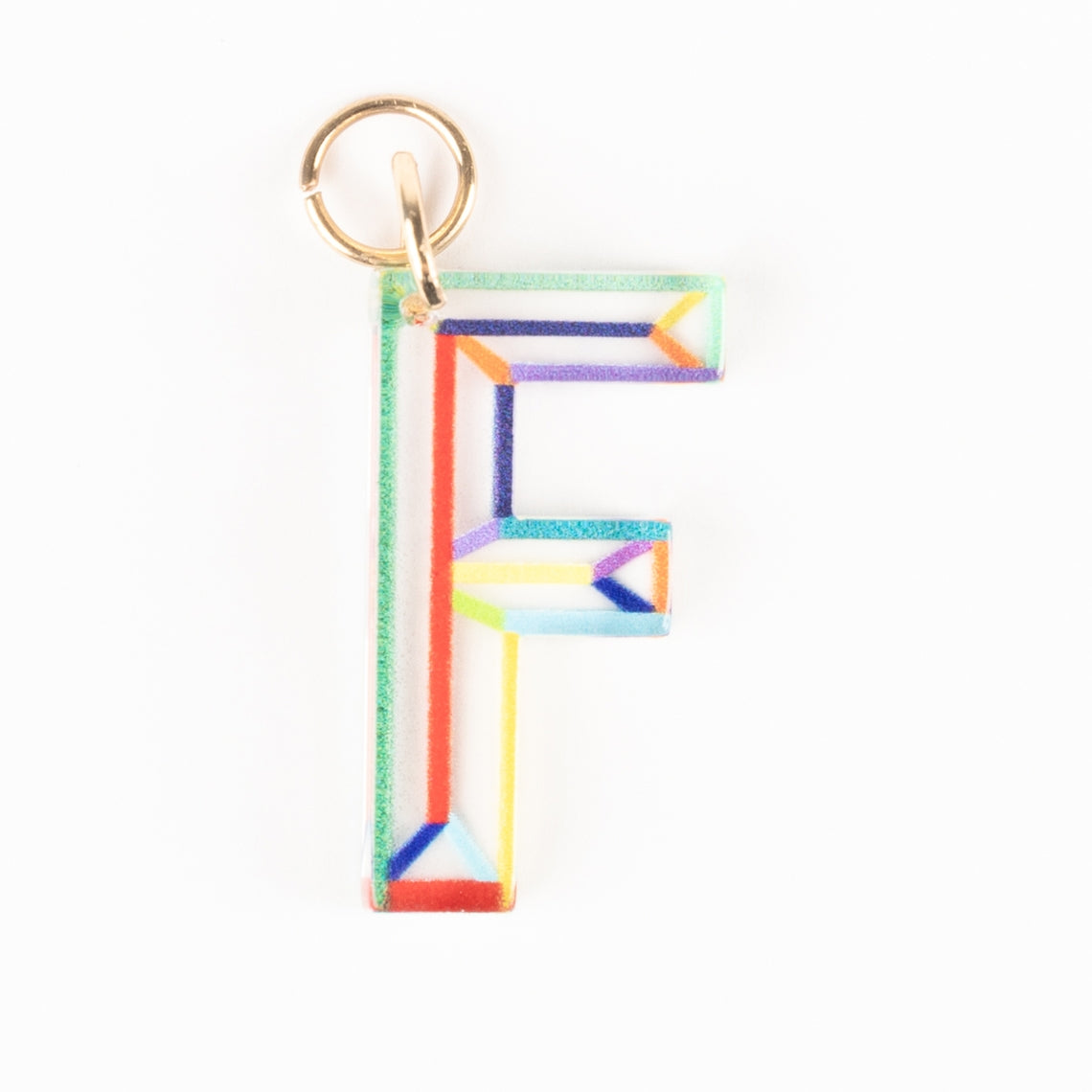Marlow Initial Bag Charm featuring a clear acrylic letter F with colorful geometric line patterns.