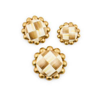Three round MacKenzie-Childs magnets in small, medium, and large with gold beaded edges.
