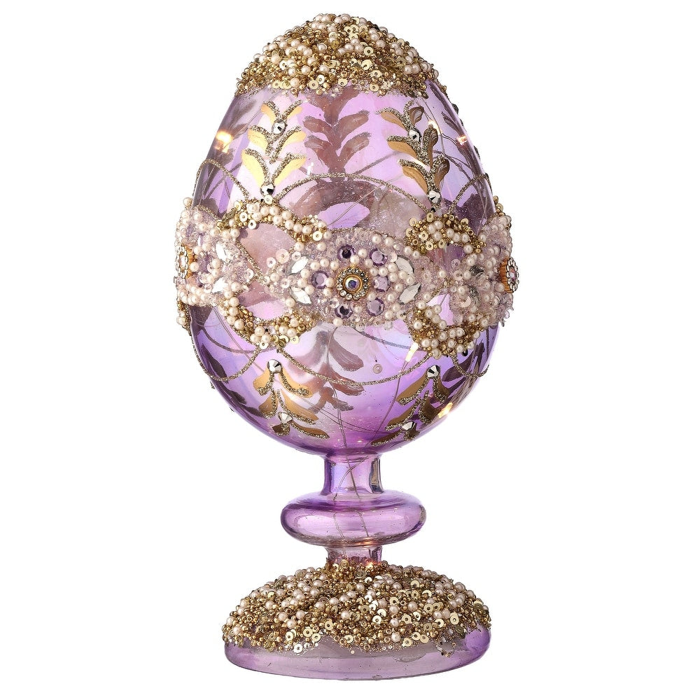 8-inch glass LED egg pedestal with warm white lights and sparkling jewel accents on a faceted surface.