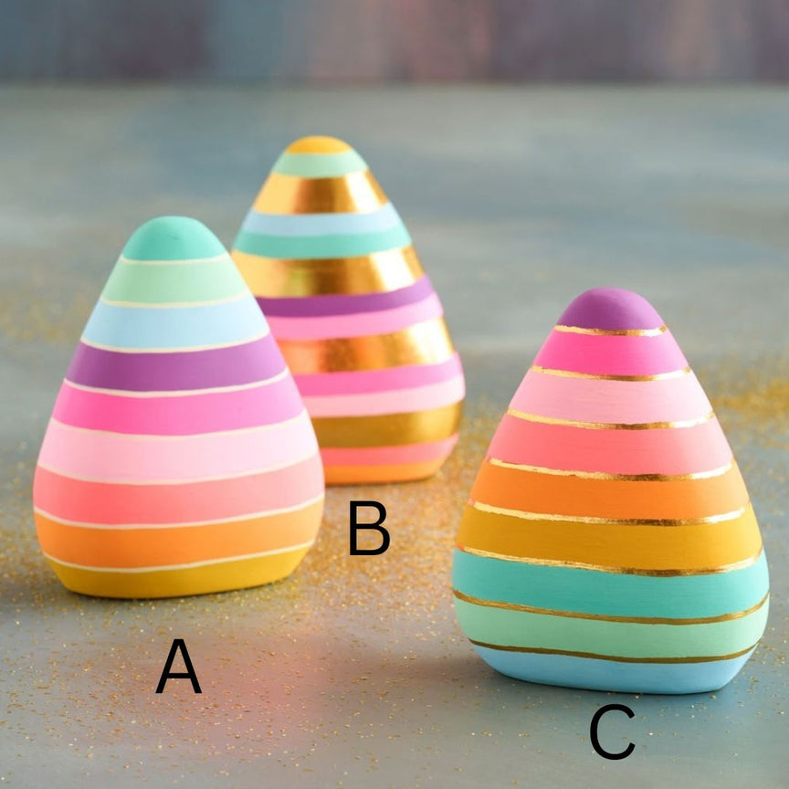 Hand-painted resin candy corn figurine with gold leaf accents measuring 7.5 inches.