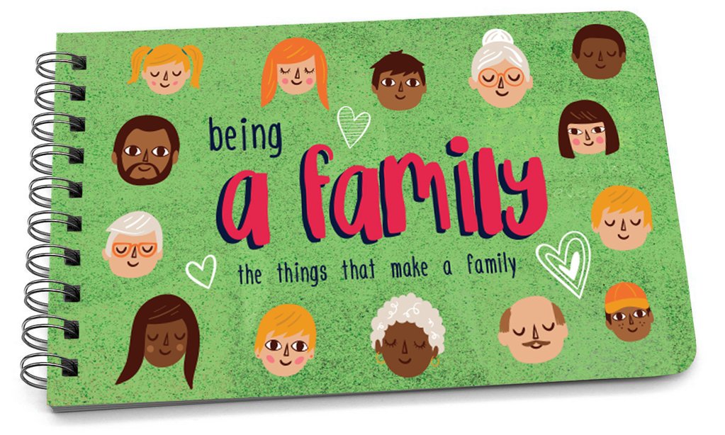 Green handbook cover with "being a family" in large pink letters and illustrations of diverse faces.