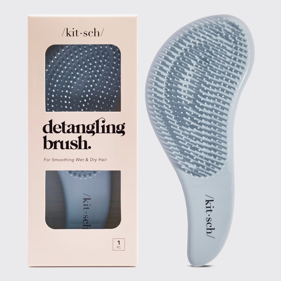 Detangling brush with flexible bristles in sleek black finish