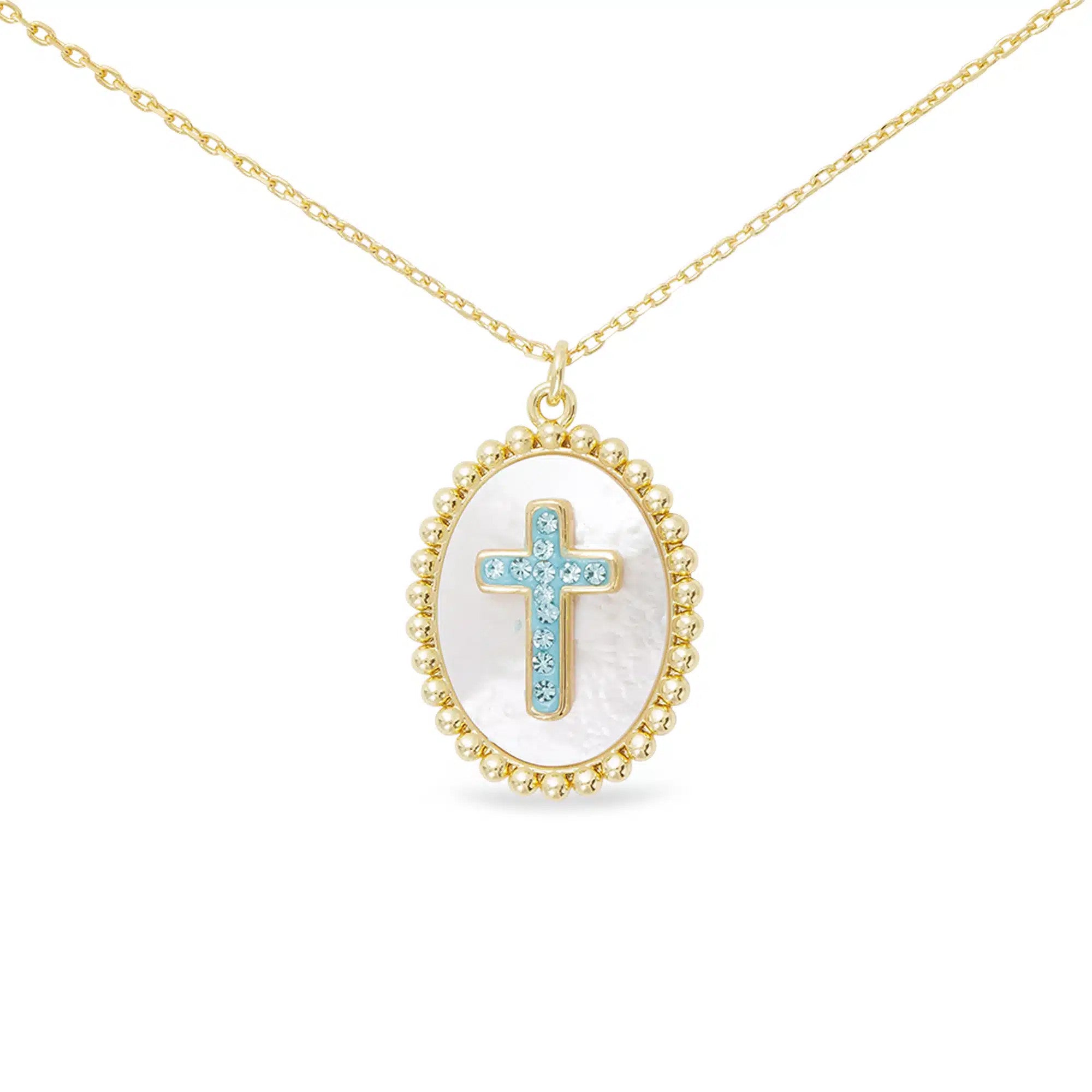 Gold necklace with an oval mother of pearl pendant featuring a blue CZ-accented cross.