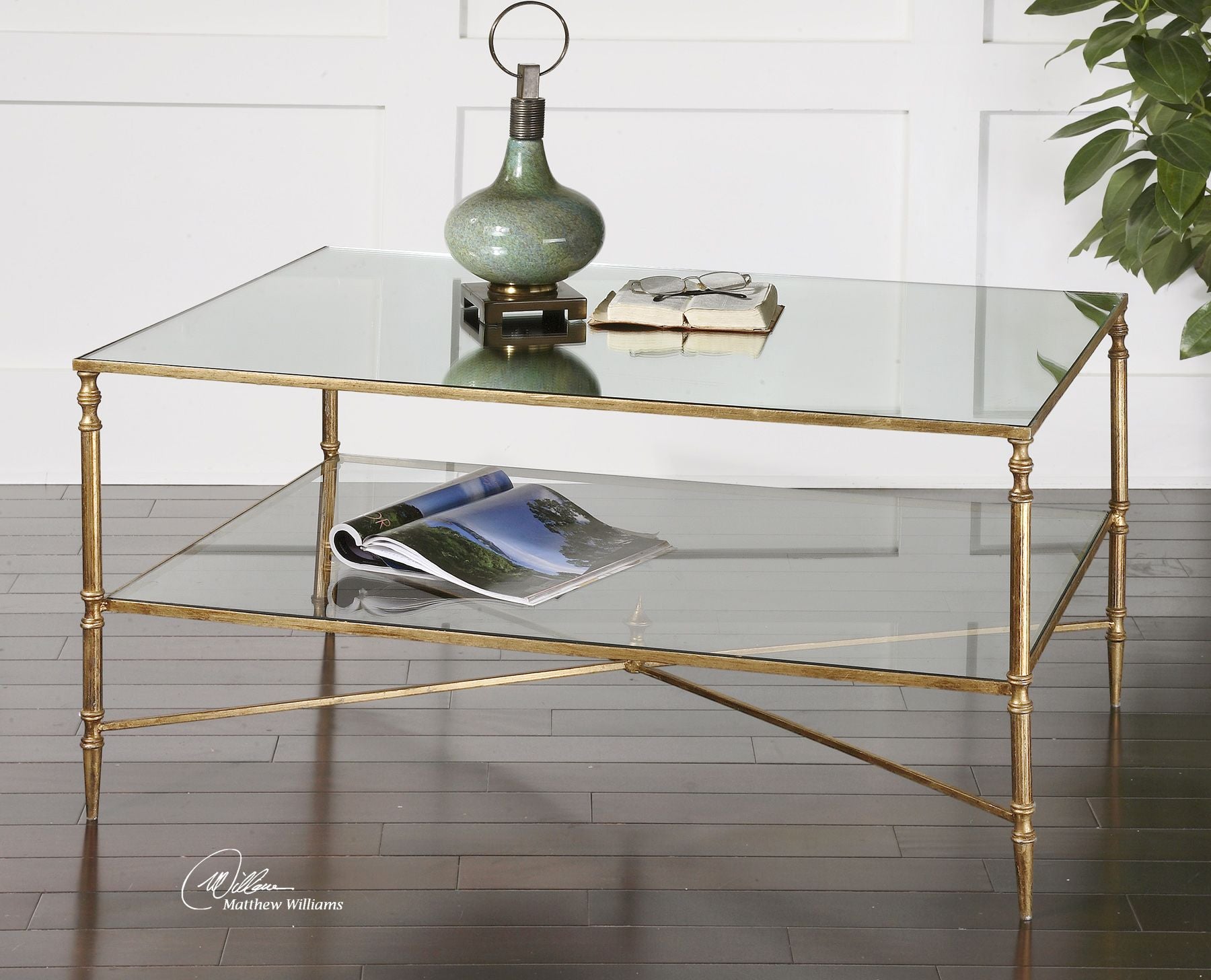 Rectangular mirrored glass coffee table with a sleek modern frame.