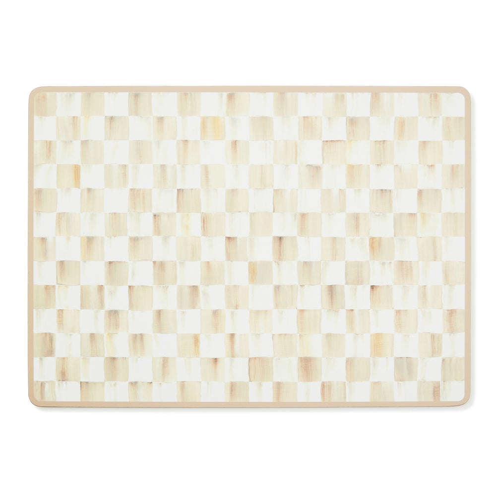 Rectangular placemat with a mocha and cream hand-painted checkerboard pattern and cork backing.