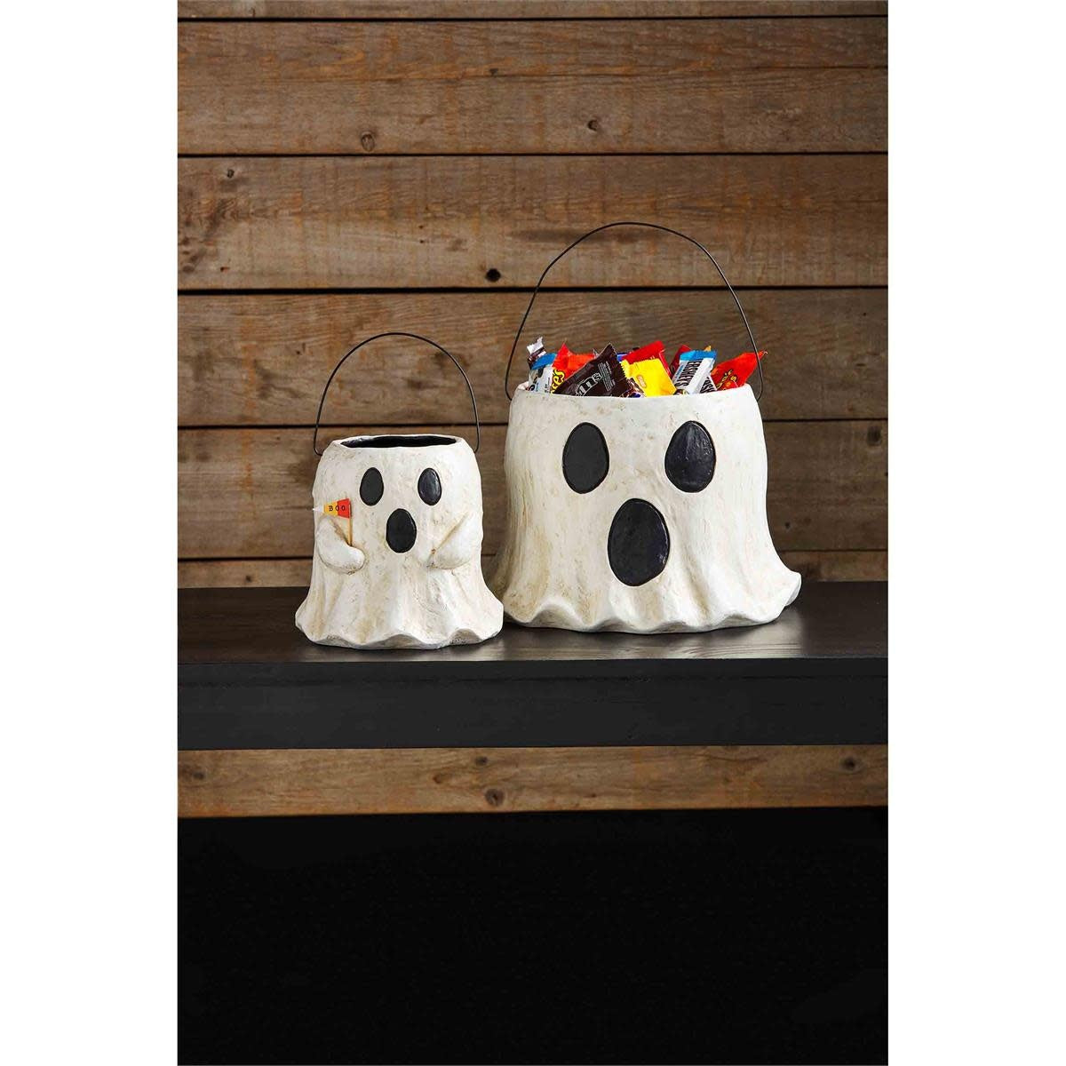 Two hand-painted papier-mache ghost treat buckets in white with black accents.