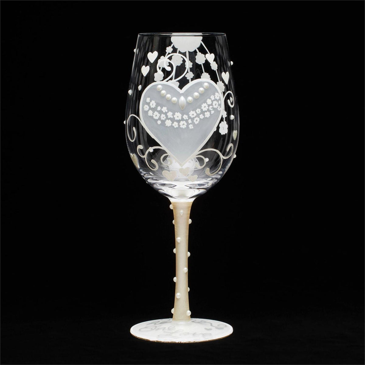 Blown glass wine glass with hand-painted festive designs, glitter accents, and a cocktail recipe printed on the base.