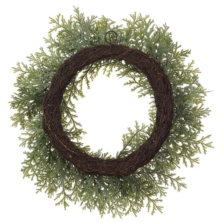 24-inch iced cedar wreath with green frosted foliage on a brown grapevine base.