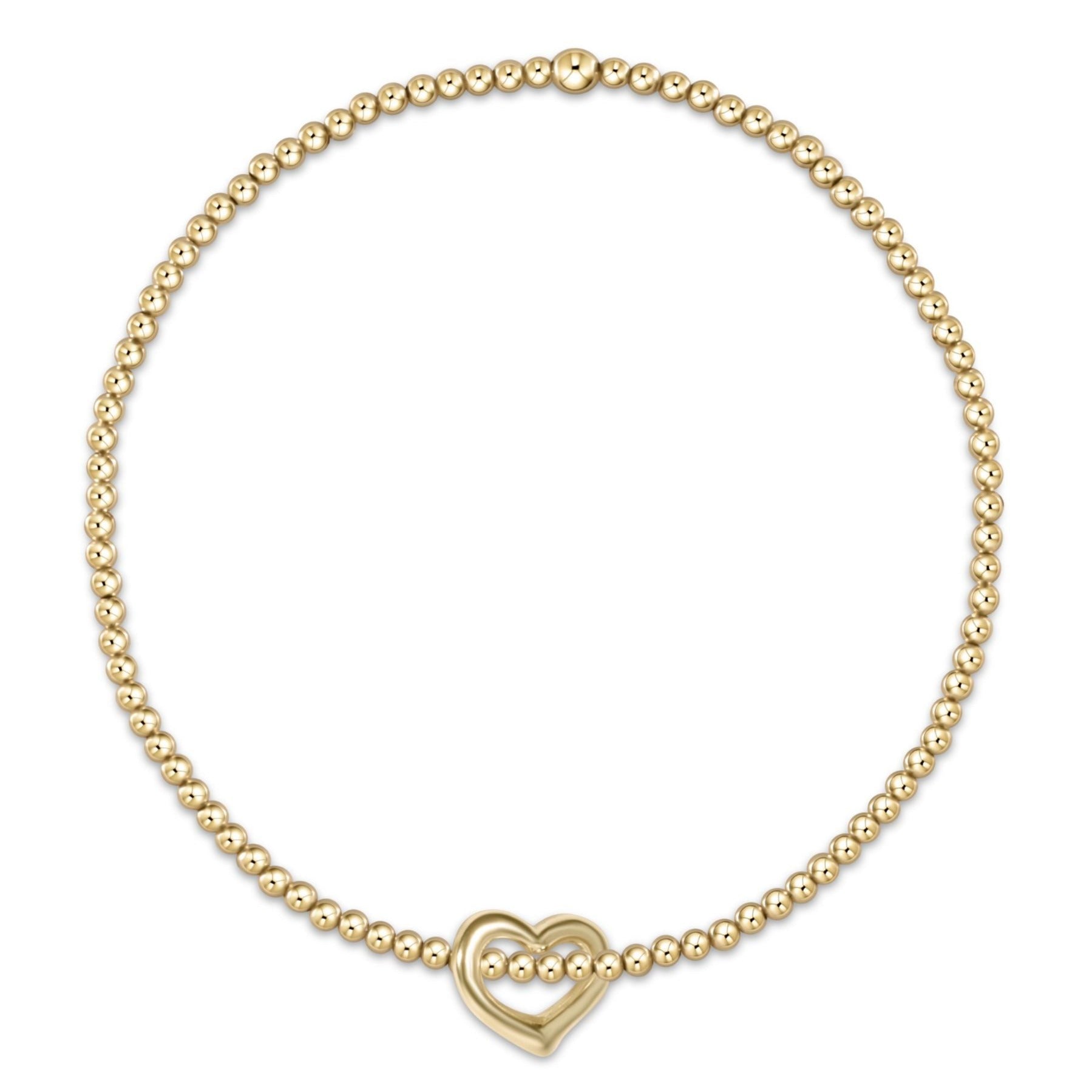 Classic gold bracelet with small love charm on elastic band