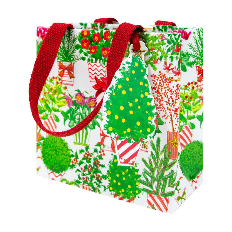 Small Christmas gift bag with floral market print on durable paper featuring a strong handle.