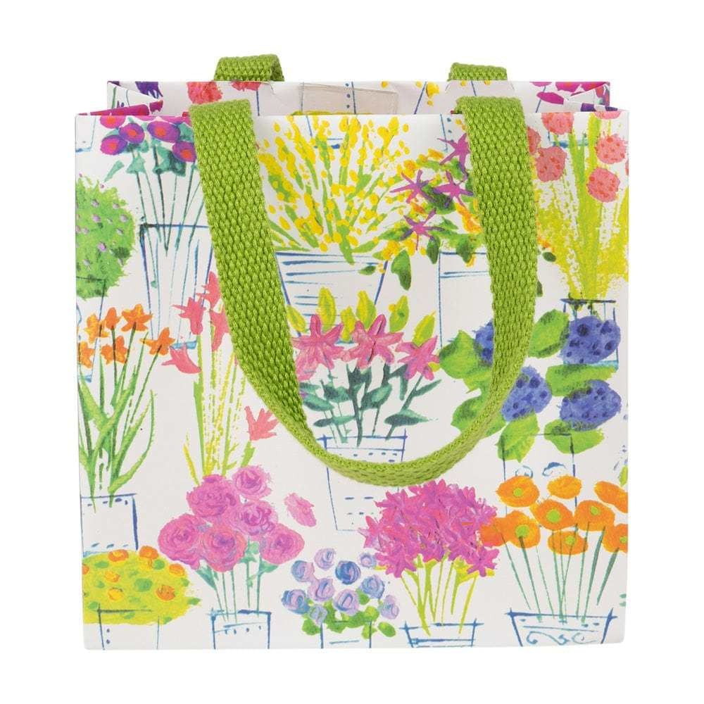 Small floral-patterned gift bag with sturdy handles on durable paper.