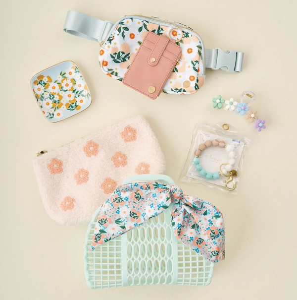 Gift basket set featuring a jelly purse with floral hair scarf, trinket dish, teddy zipper pouch, belt bag, wallet, key ring, and claw clip.