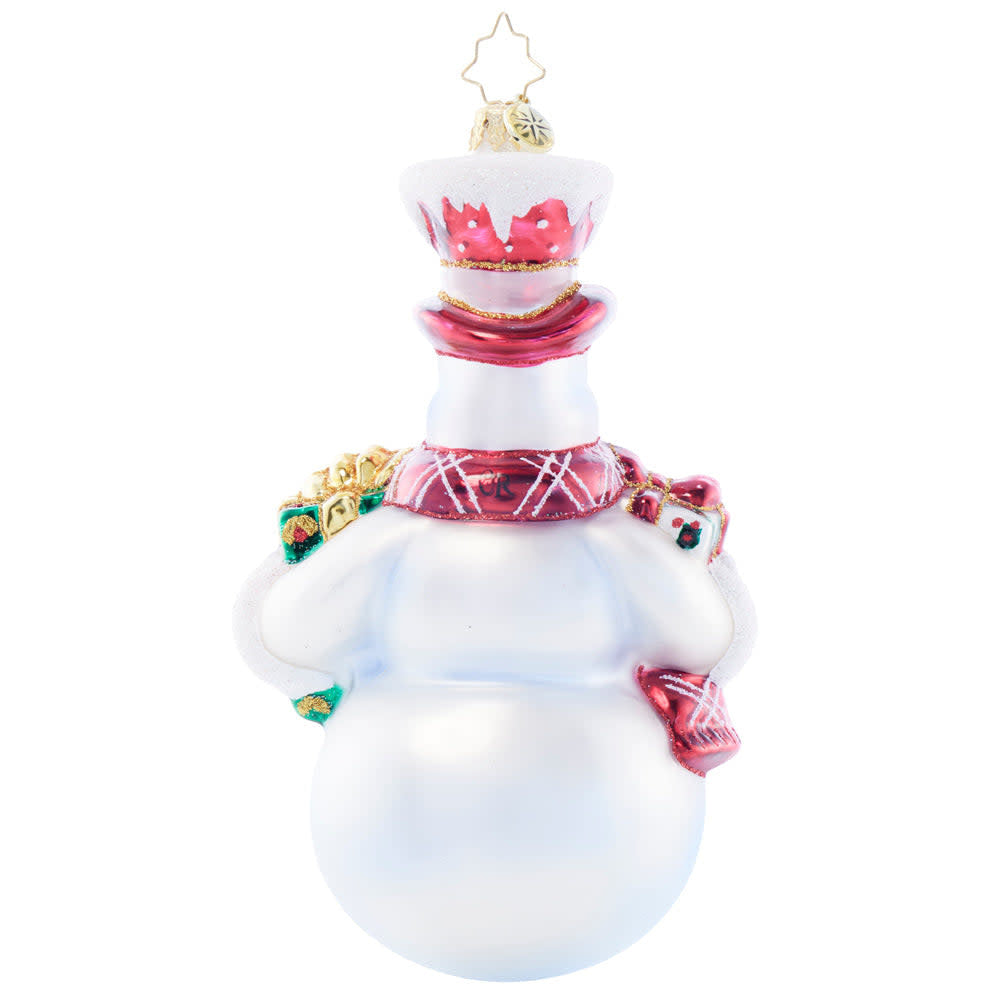 Gift Giving Joy figurine showing a man in a suit holding wrapped holiday gifts.