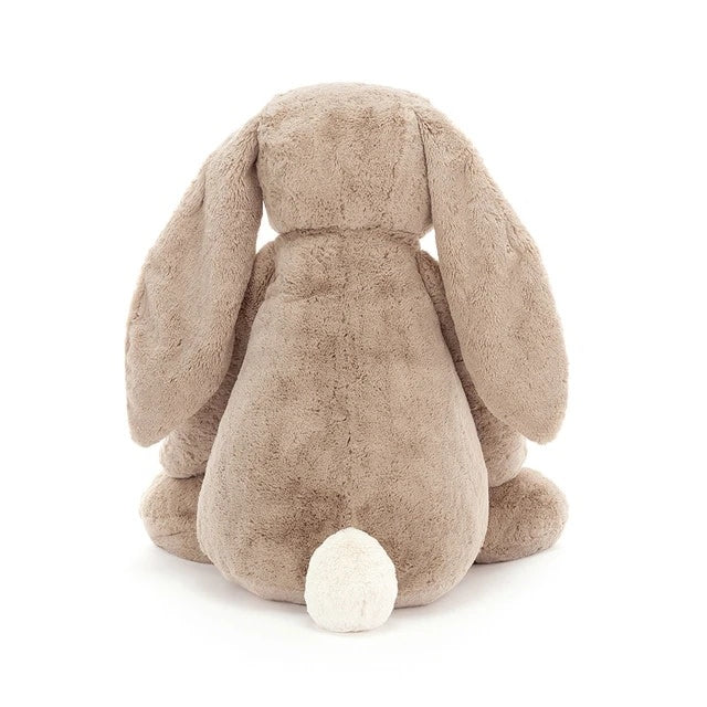 Gigantic Bashful Bunny plush toy in beige polyester with floppy ears filled with PE beans.