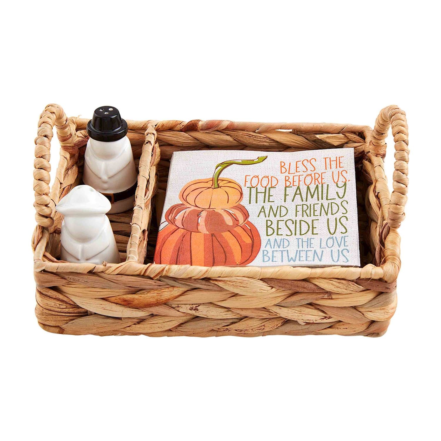 Woven basket set with pilgrim salt and pepper shakers and pumpkin-themed napkins.