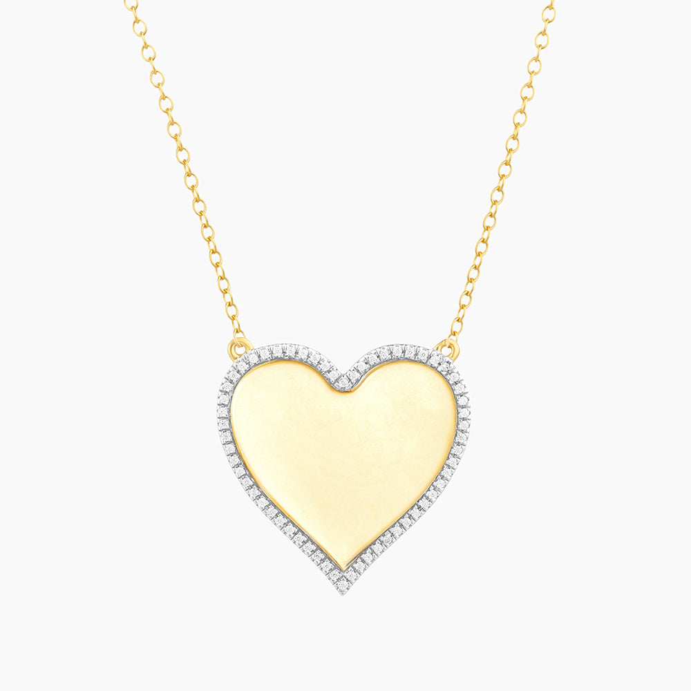 Sterling silver pendant necklace with a heart-shaped diamond-accented charm on an adjustable chain.