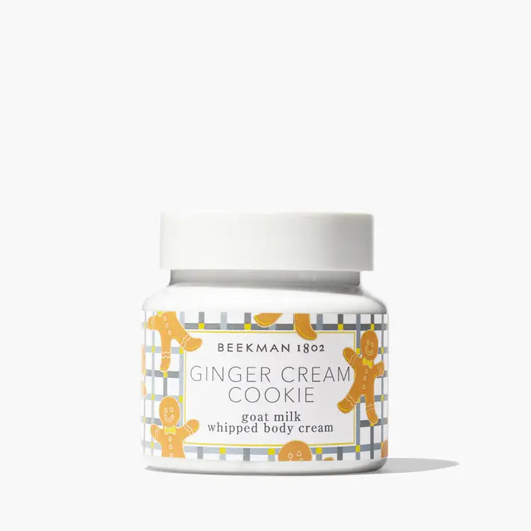 White jar of whipped body cream with a silver lid