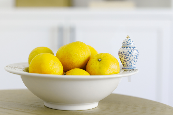 Small ginger-colored ceramic jar with a rounded silhouette.
