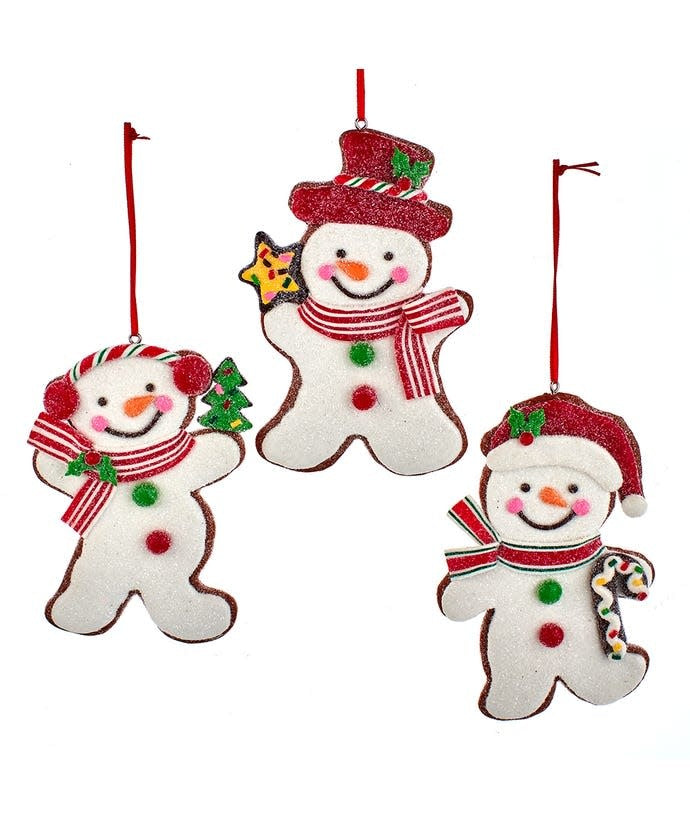 Claydough gingerbread snowman ornament with black eyes and carrot nose on a white background