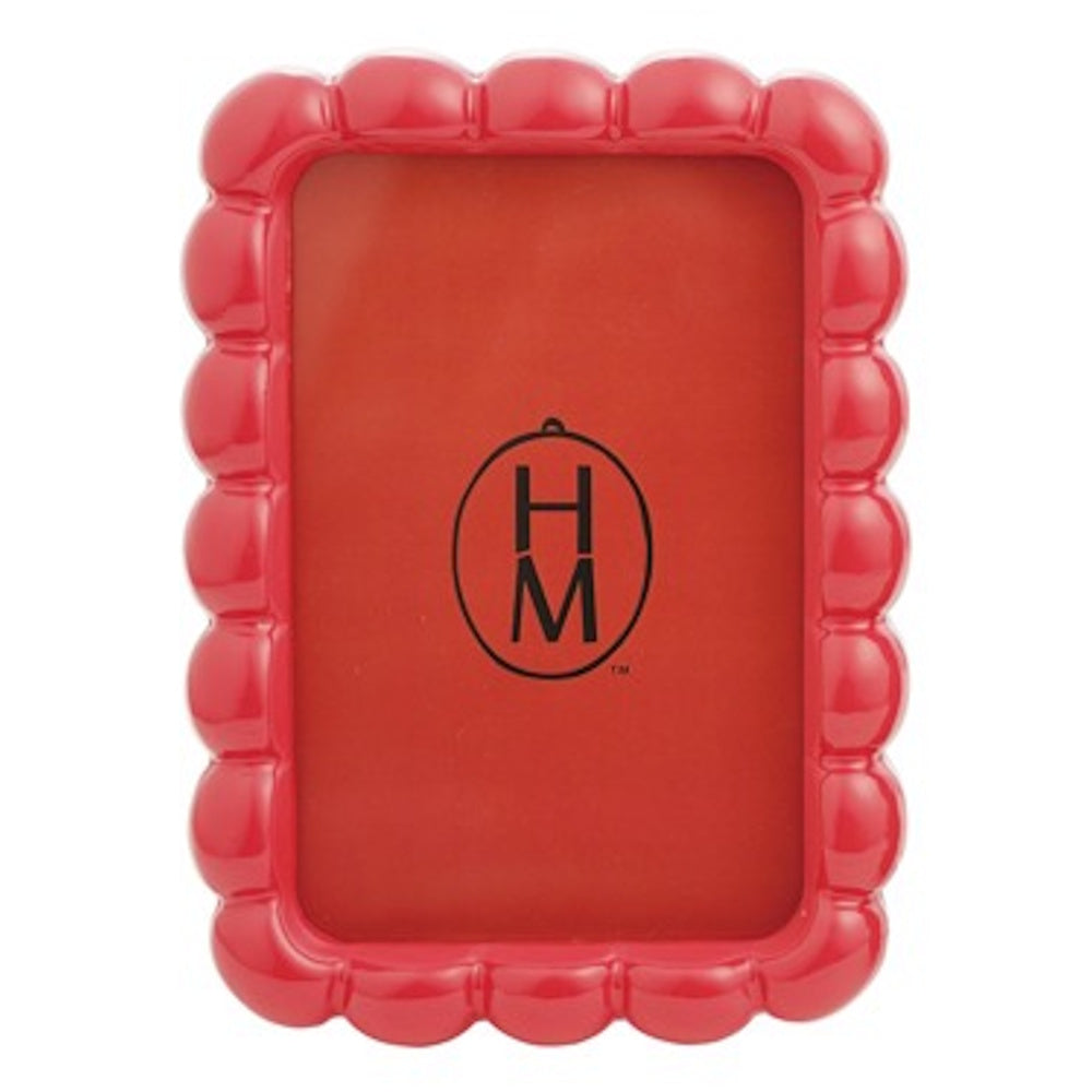 Red resin photo frame with a glossy scalloped edge design, sized 4x6 inches.