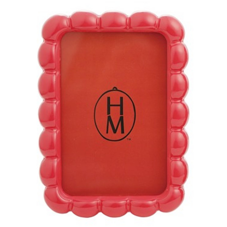 Red resin photo frame with a glossy scalloped edge design, sized 4x6 inches.
