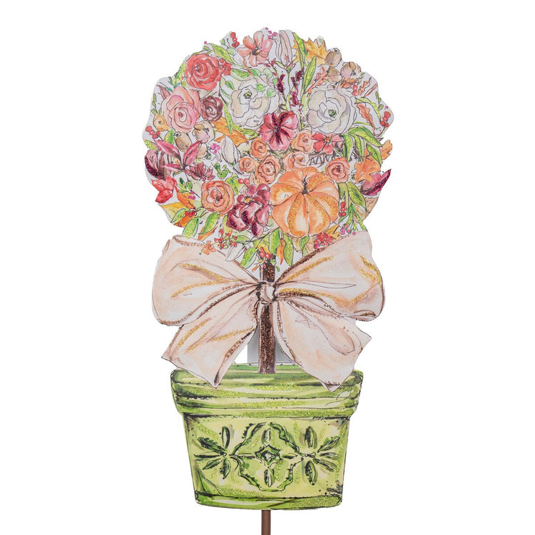 Small watercolor-style rose and pumpkin topiary in a green pot with a large beige bow.