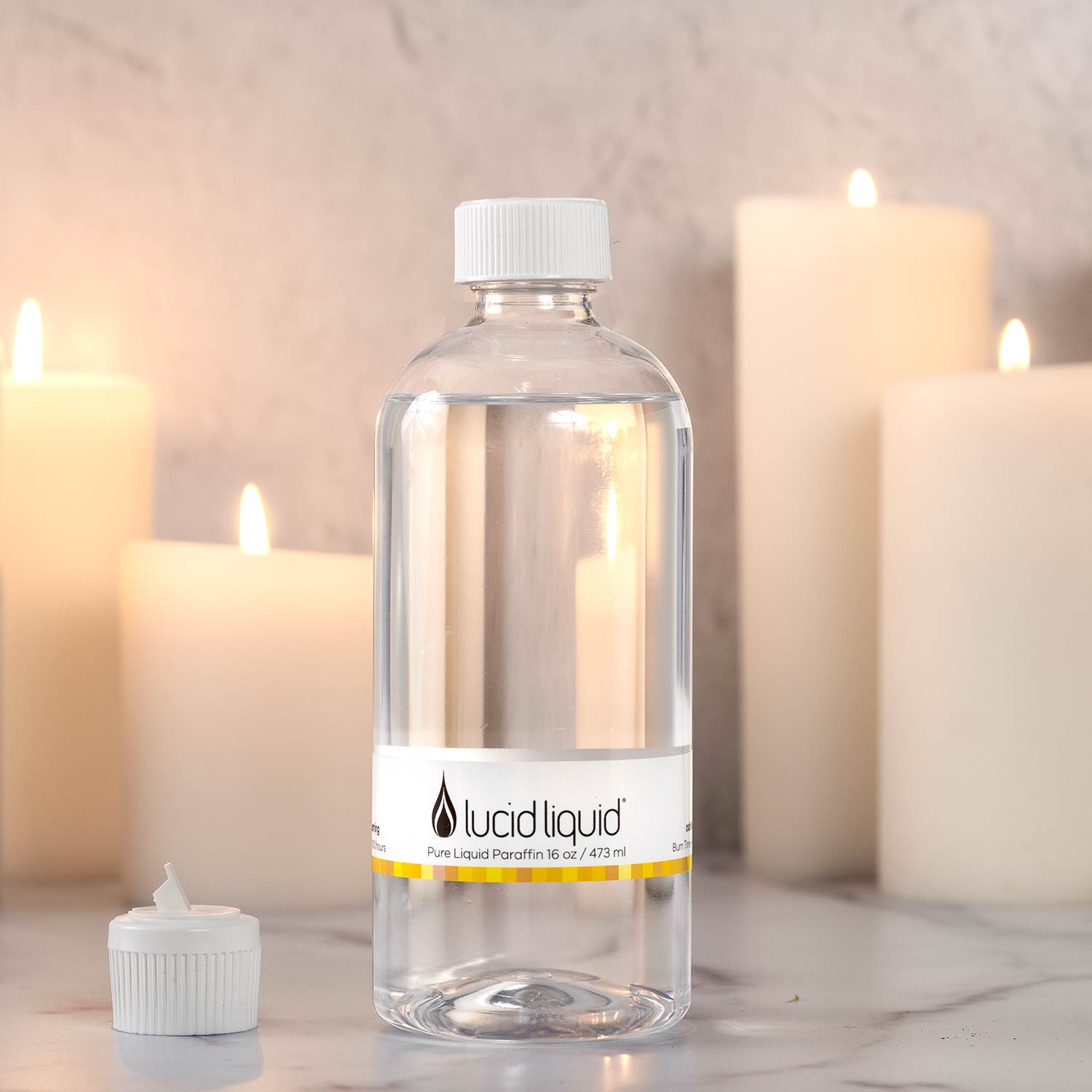 Clear bottle containing Lucid liquid wax in a neutral shade.